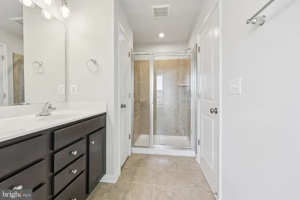 a view of empty room with wooden ceiling
