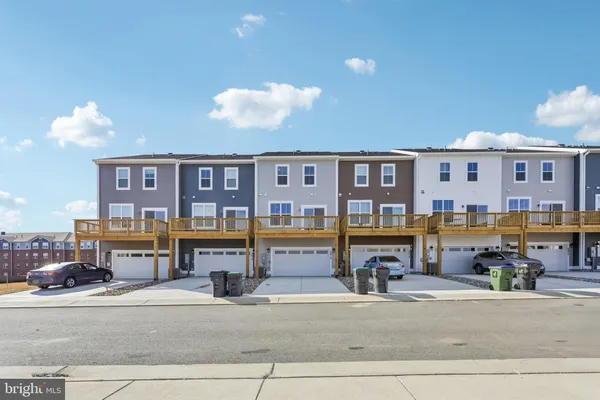 a view of a building with car parked