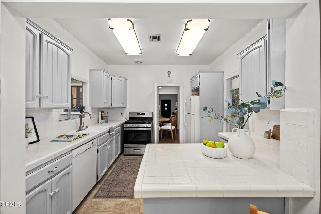 1870 Brigden Road Pasadena, CA 91104 - Photo 16 of 46 a large white kitchen with a stove