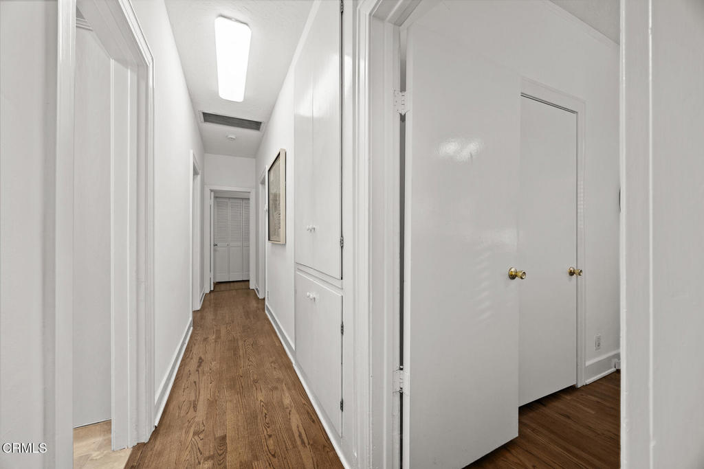 1870 Brigden Road Pasadena, CA 91104 - Photo 19 of 46 a view of a hallway with wooden floor and staircase