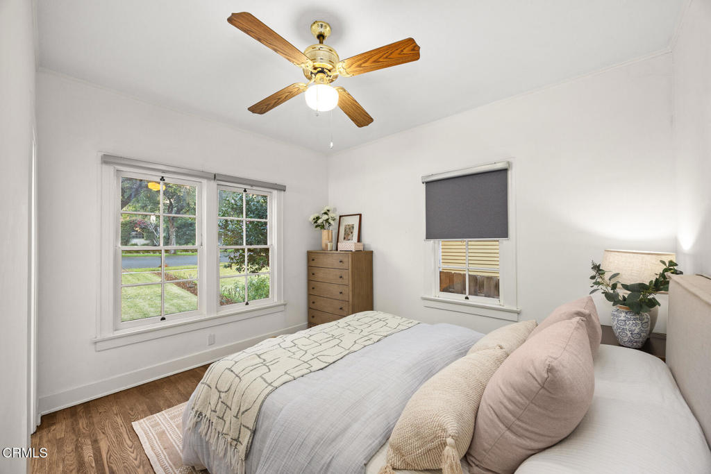 1870 Brigden Road Pasadena, CA 91104 - Photo 23 of 46 a bedroom with a large bed tv and a window