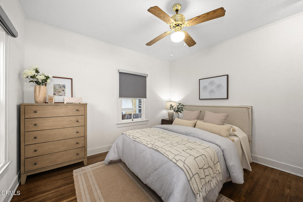 1870 Brigden Road Pasadena, CA 91104 - Photo 24 of 46 a bedroom with a bed and a chandelier