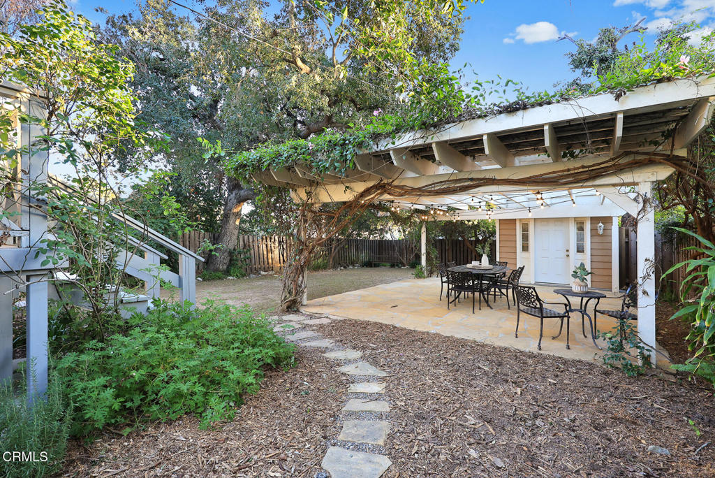 1870 Brigden Road Pasadena, CA 91104 - Photo 28 of 46 a view of a backyard with a patio and outdoor seating