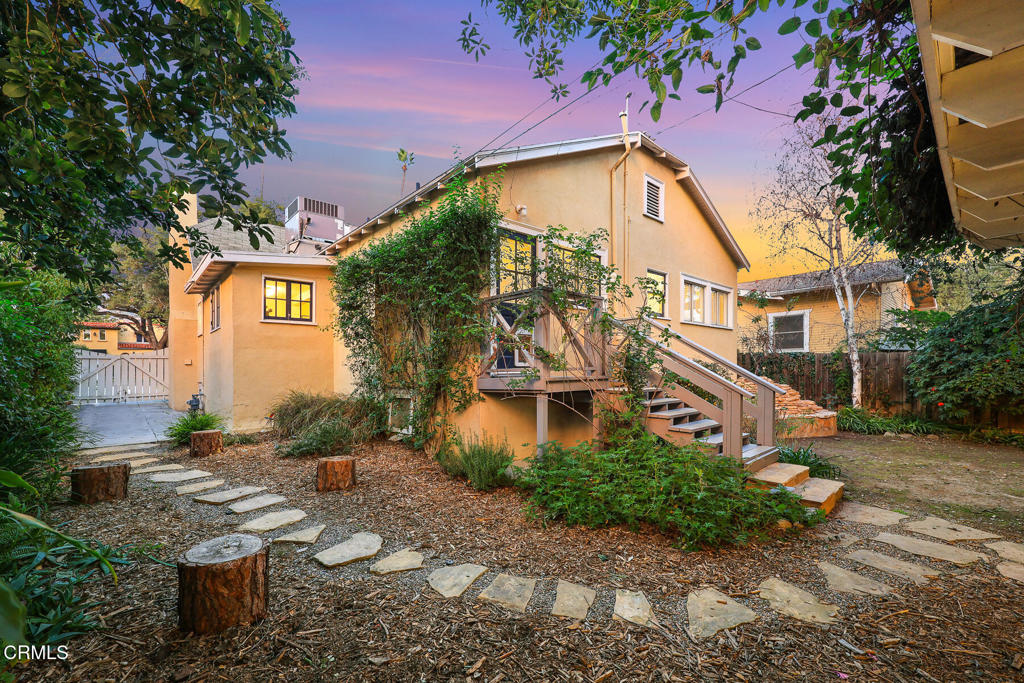 1870 Brigden Road Pasadena, CA 91104 - Photo 39 of 46 a front view of a house with garden and trees