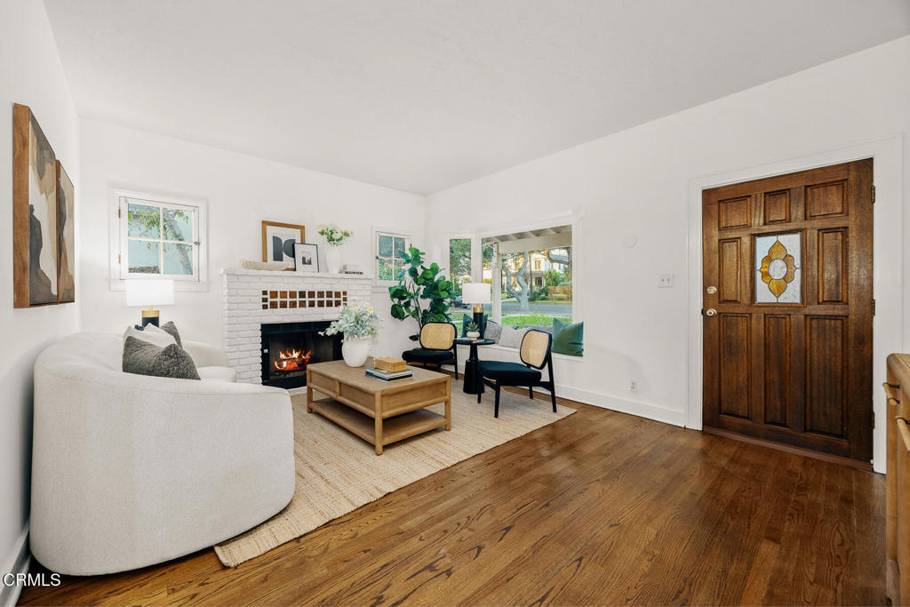 1870 Brigden Road Pasadena, CA 91104 - Photo 7 of 46 a living room with furniture and a fireplace