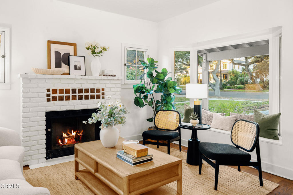 1870 Brigden Road Pasadena, CA 91104 - Photo 9 of 46 a living room with furniture a fireplace and a large window