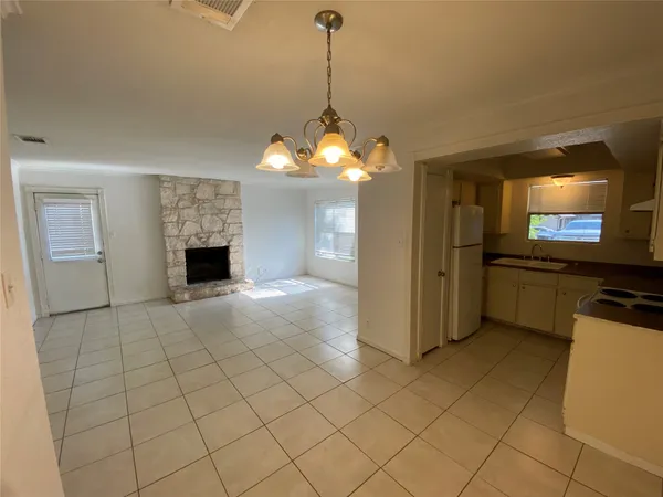a view of a livingroom with furniture and a fireplace