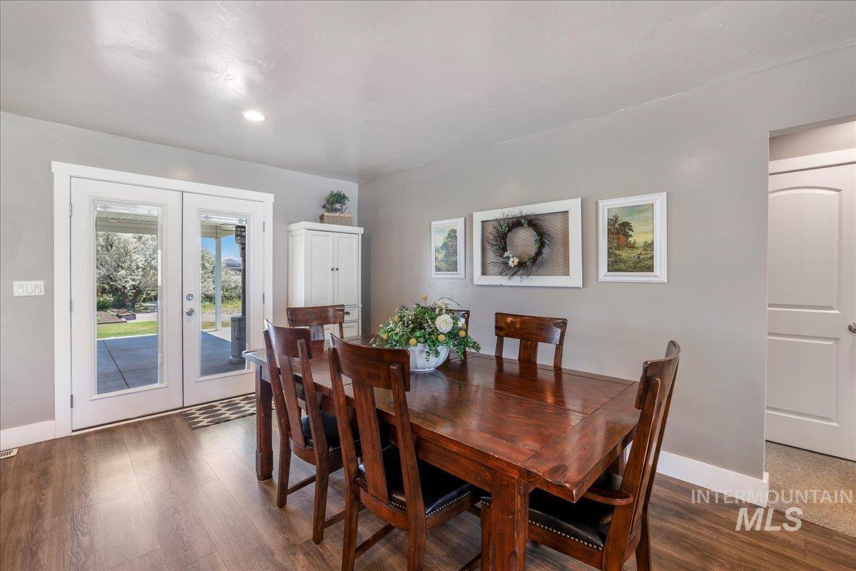 4076 North 3446 East Kimberly, ID 83341 - Photo 13 of 45 Dining space with wood finished floors and french doors