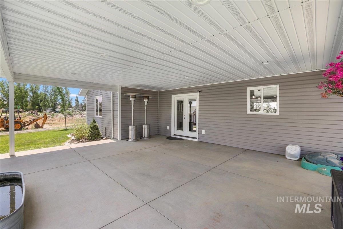 4076 North 3446 East Kimberly, ID 83341 - Photo 31 of 45 View of patio featuring french doors and an attached carport