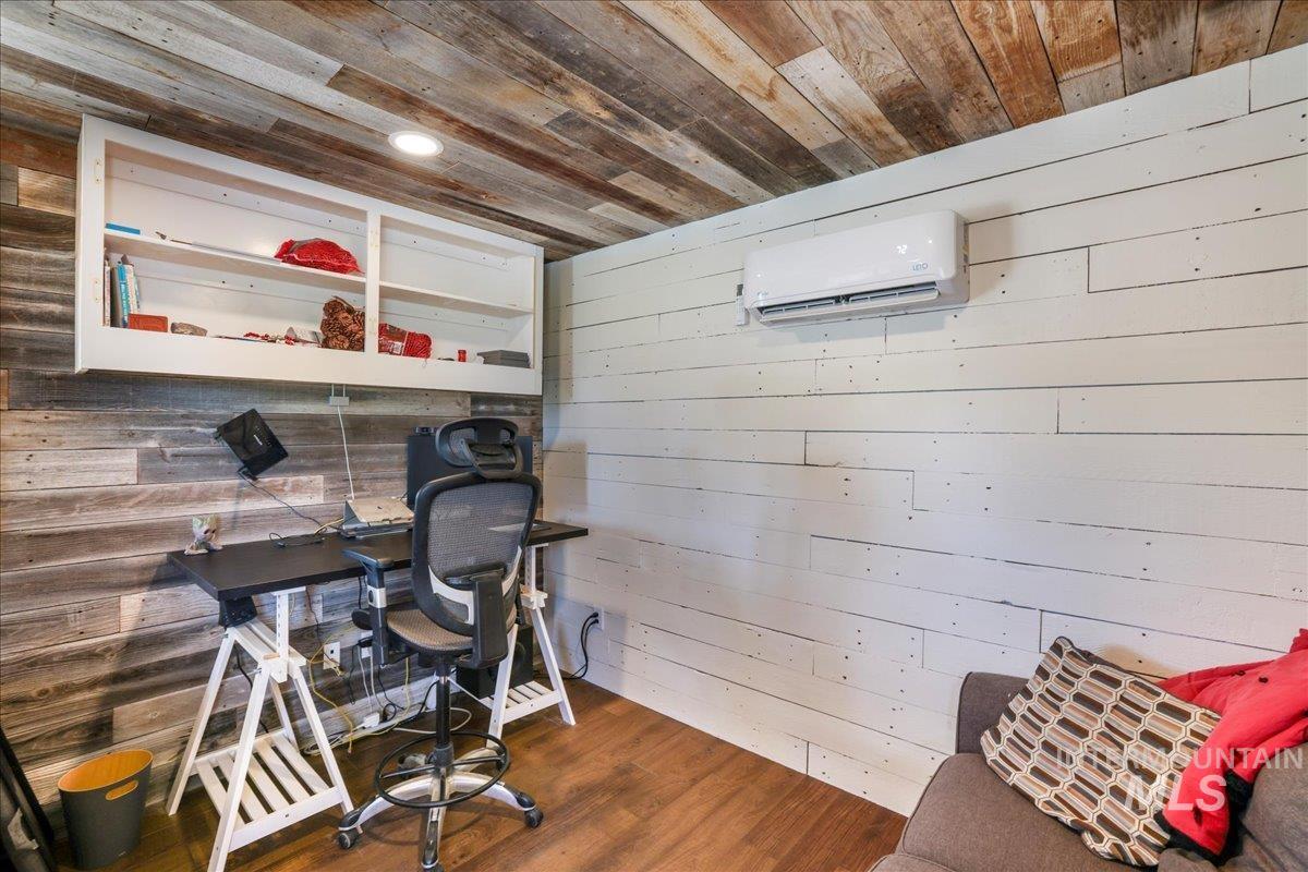4076 North 3446 East Kimberly, ID 83341 - Photo 33 of 45 Office space featuring wood walls, an AC wall unit, wooden ceiling, wood finished floors, and recessed lighting