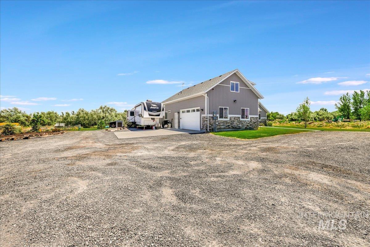4076 North 3446 East Kimberly, ID 83341 - Photo 36 of 45 View of side of home with driveway and stone siding