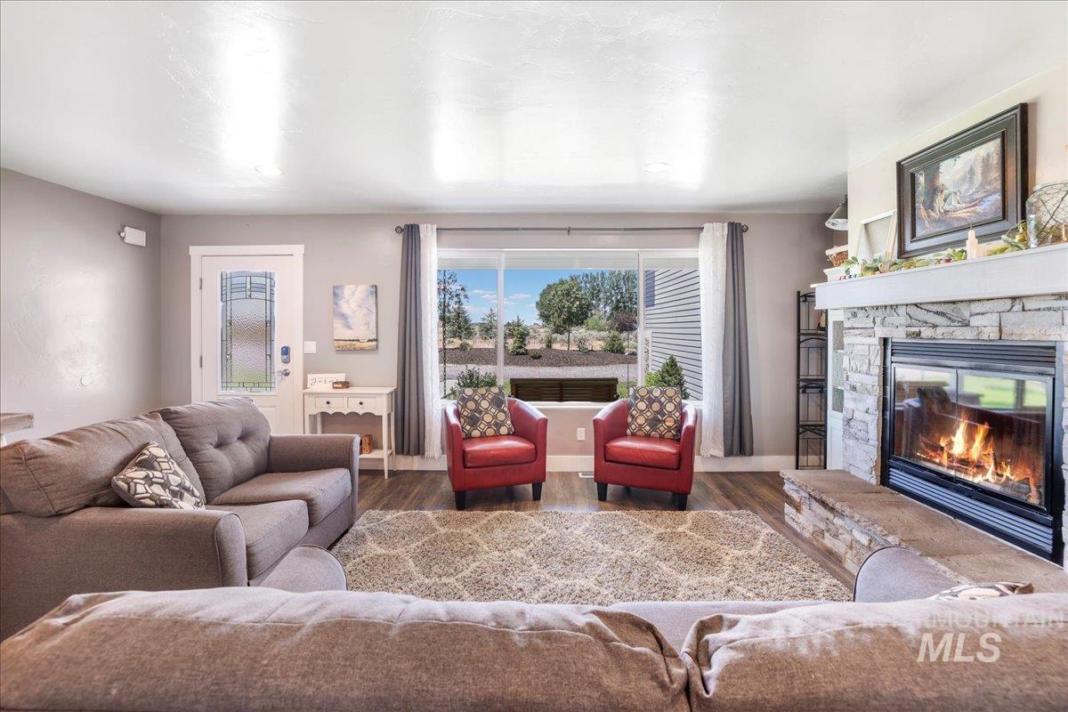 4076 North 3446 East Kimberly, ID 83341 - Photo 6 of 45 Living room featuring a fireplace and wood finished floors