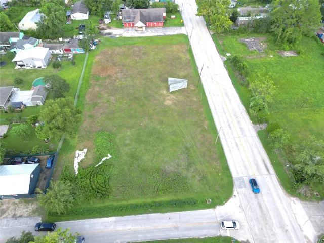 a view of a garden with a building in the background