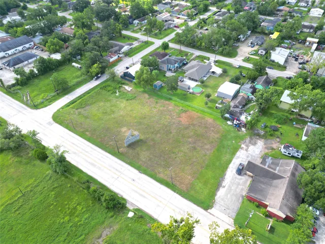 a view of a green yard with a house