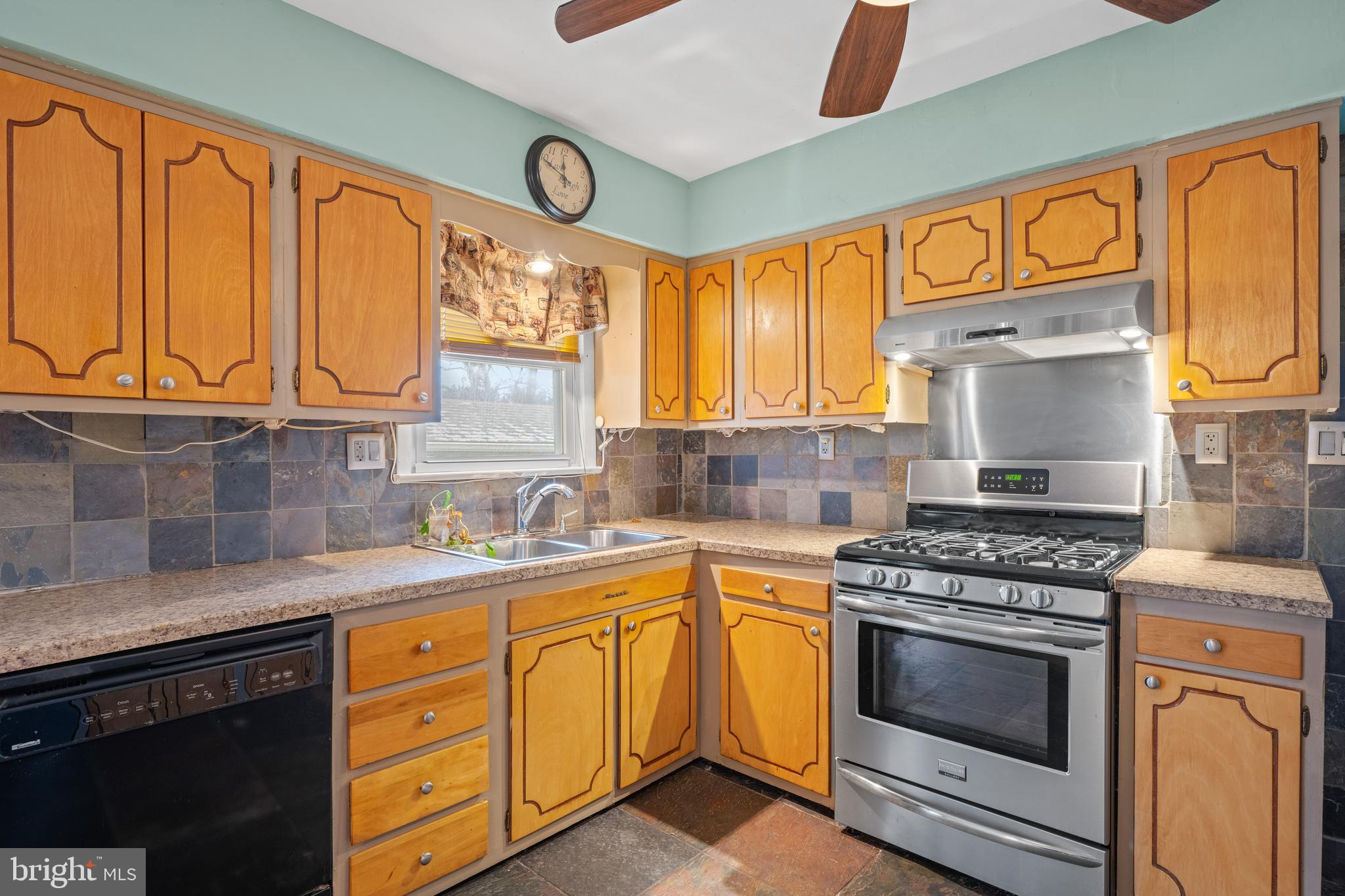 866 North Brewster Road Vineland, NJ 08361 - Photo 18 of 46 a kitchen with stainless steel appliances granite countertop a stove a sink and a microwave