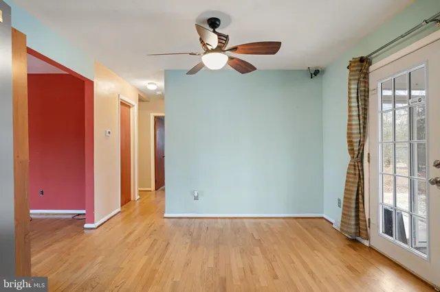 a bathroom with a toilet a sink and a mirror