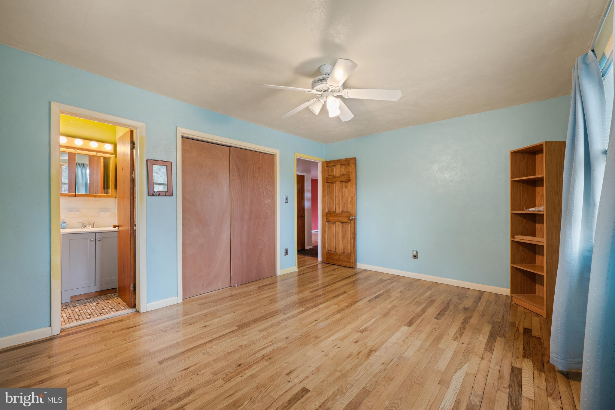 866 North Brewster Road Vineland, NJ 08361 - Photo 23 of 46 a view of an empty room with wooden floor and a window