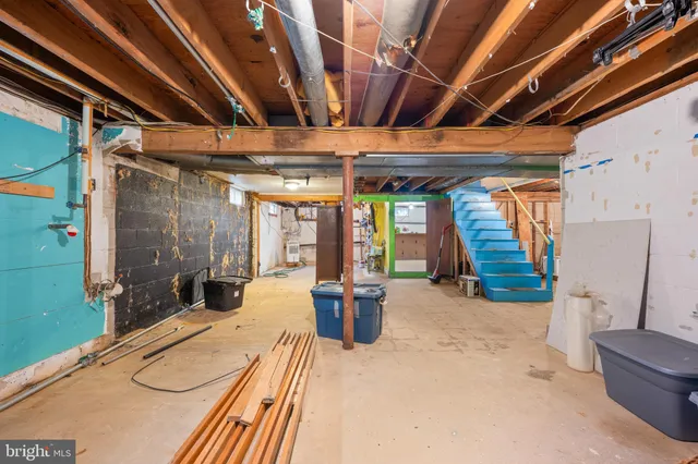 a front view of a house with a yard covered in snow
