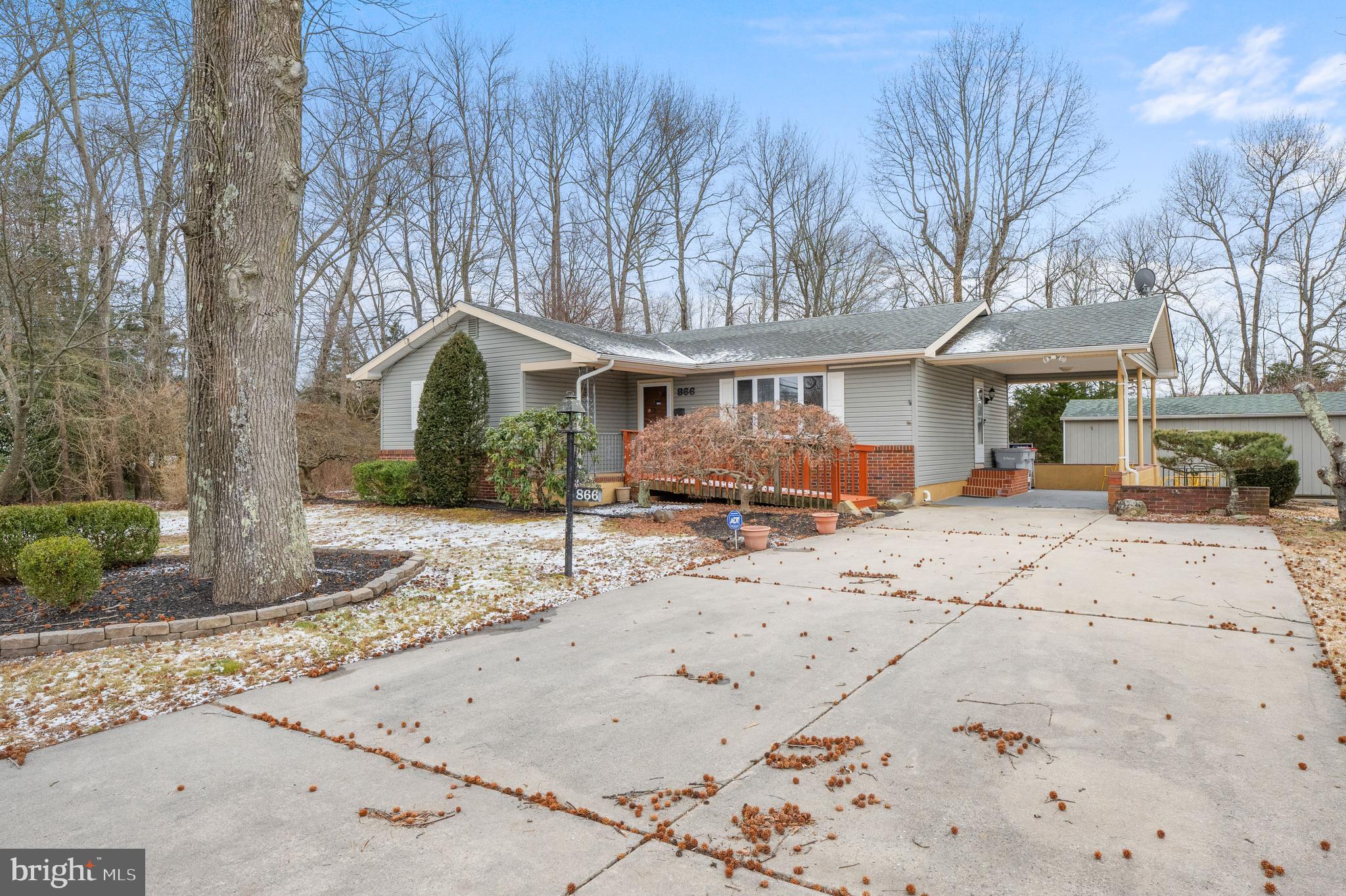 866 North Brewster Road Vineland, NJ 08361 - Photo 37 of 46 a front view of a house with a yard covered in snow