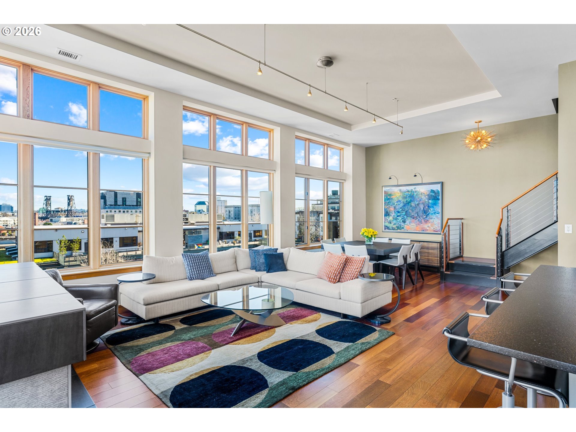 1030 Northwest Johnson Street, Unit 611 Portland, OR 97209 - Photo 11 of 34 a living room with furniture a rug and a floor to ceiling window
