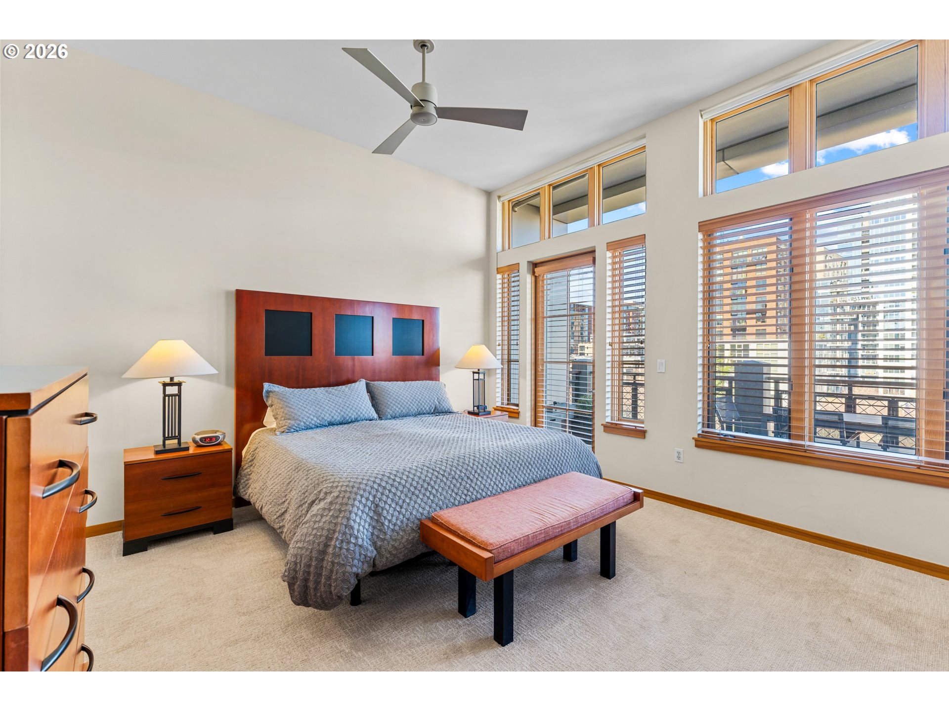 1030 Northwest Johnson Street, Unit 611 Portland, OR 97209 - Photo 17 of 34 a bedroom with furniture and a large window
