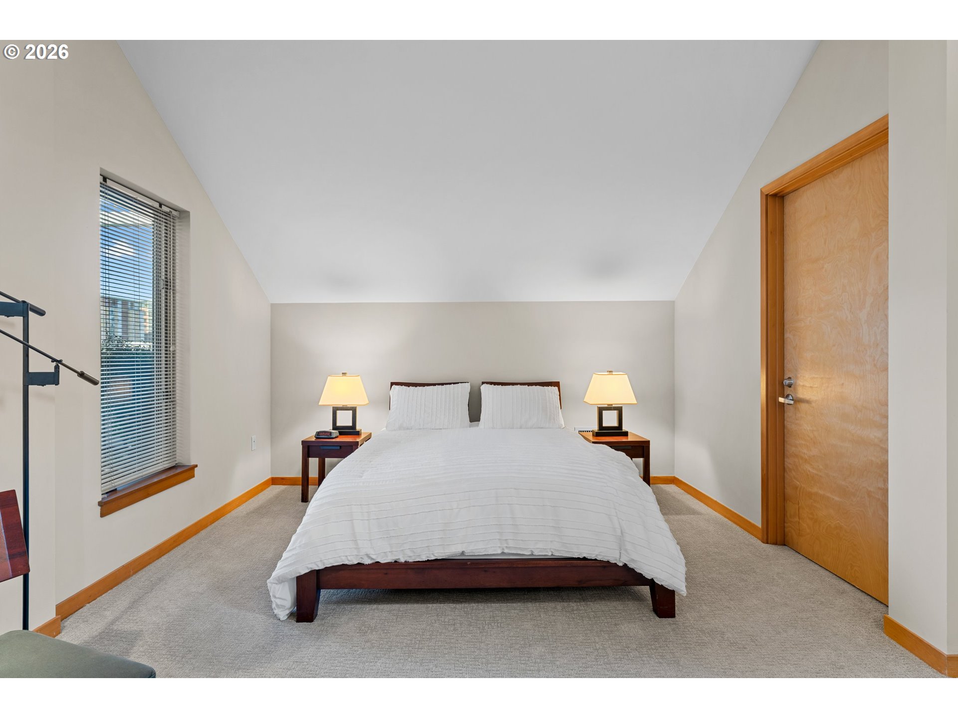 1030 Northwest Johnson Street, Unit 611 Portland, OR 97209 - Photo 26 of 34 a bedroom with a bed and a night stand