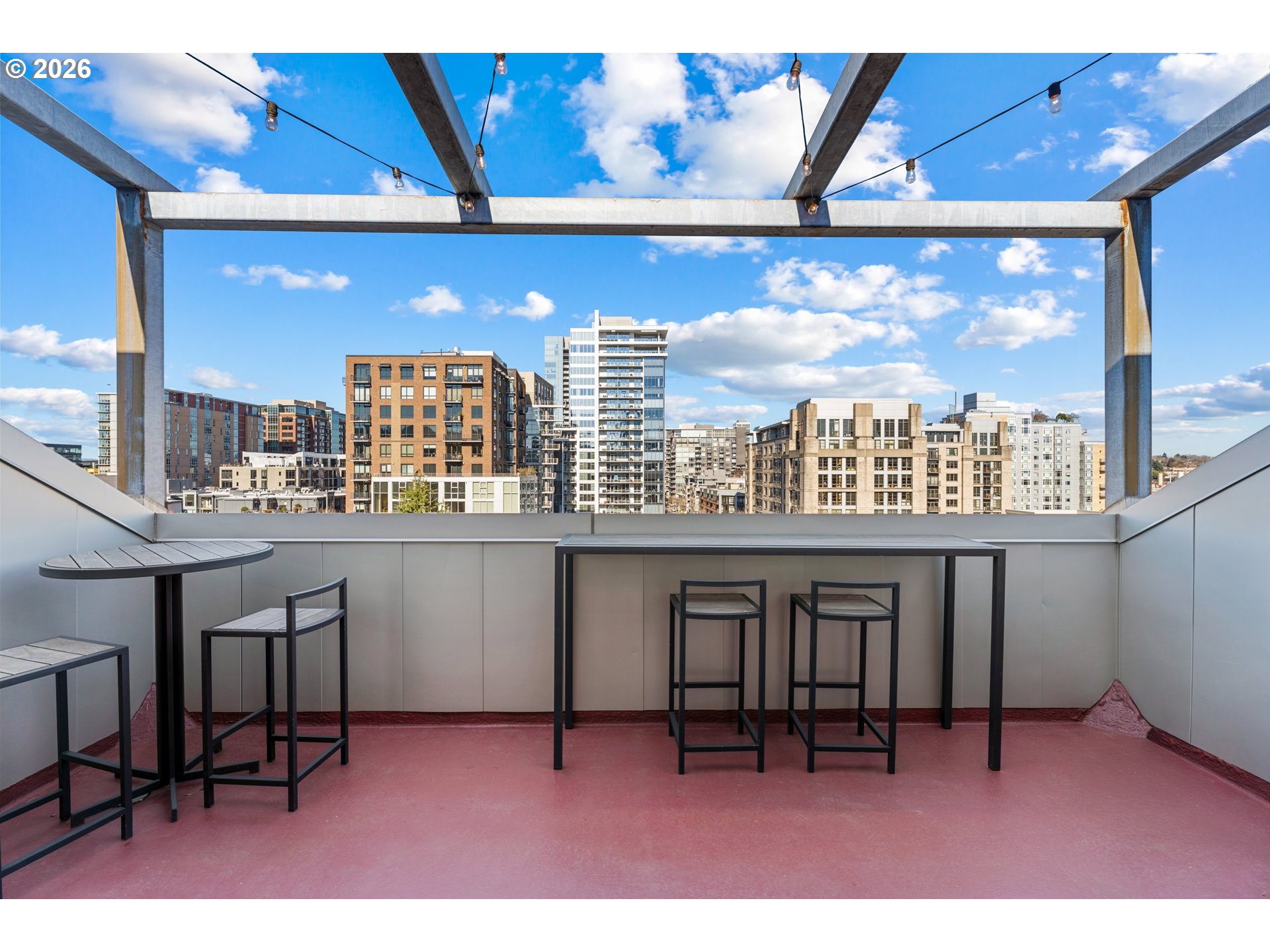 1030 Northwest Johnson Street, Unit 611 Portland, OR 97209 - Photo 31 of 34 a view of a chairs and table in a patio