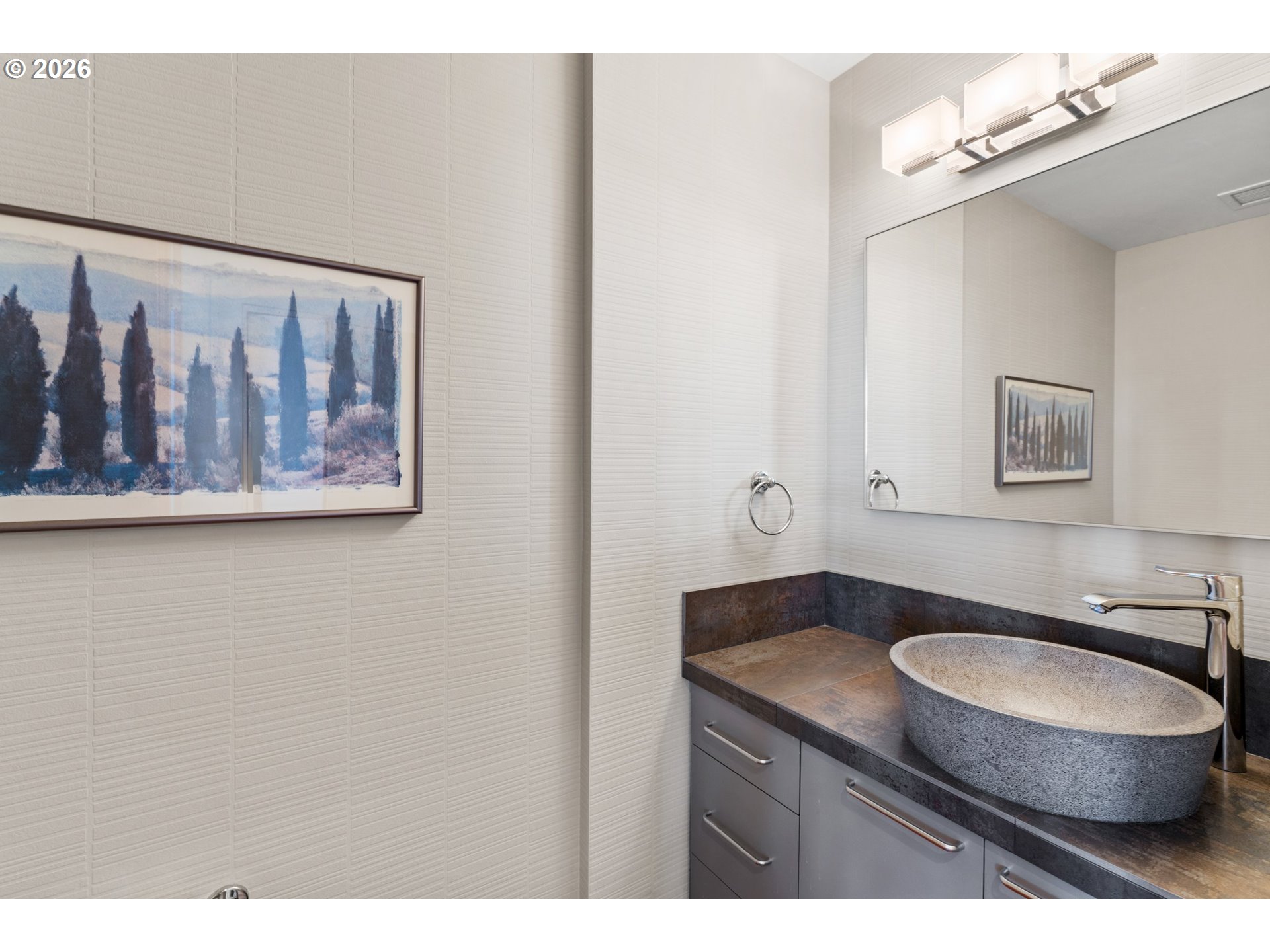 1030 Northwest Johnson Street, Unit 611 Portland, OR 97209 - Photo 32 of 34 a bathroom with a sink a mirror and a toilet