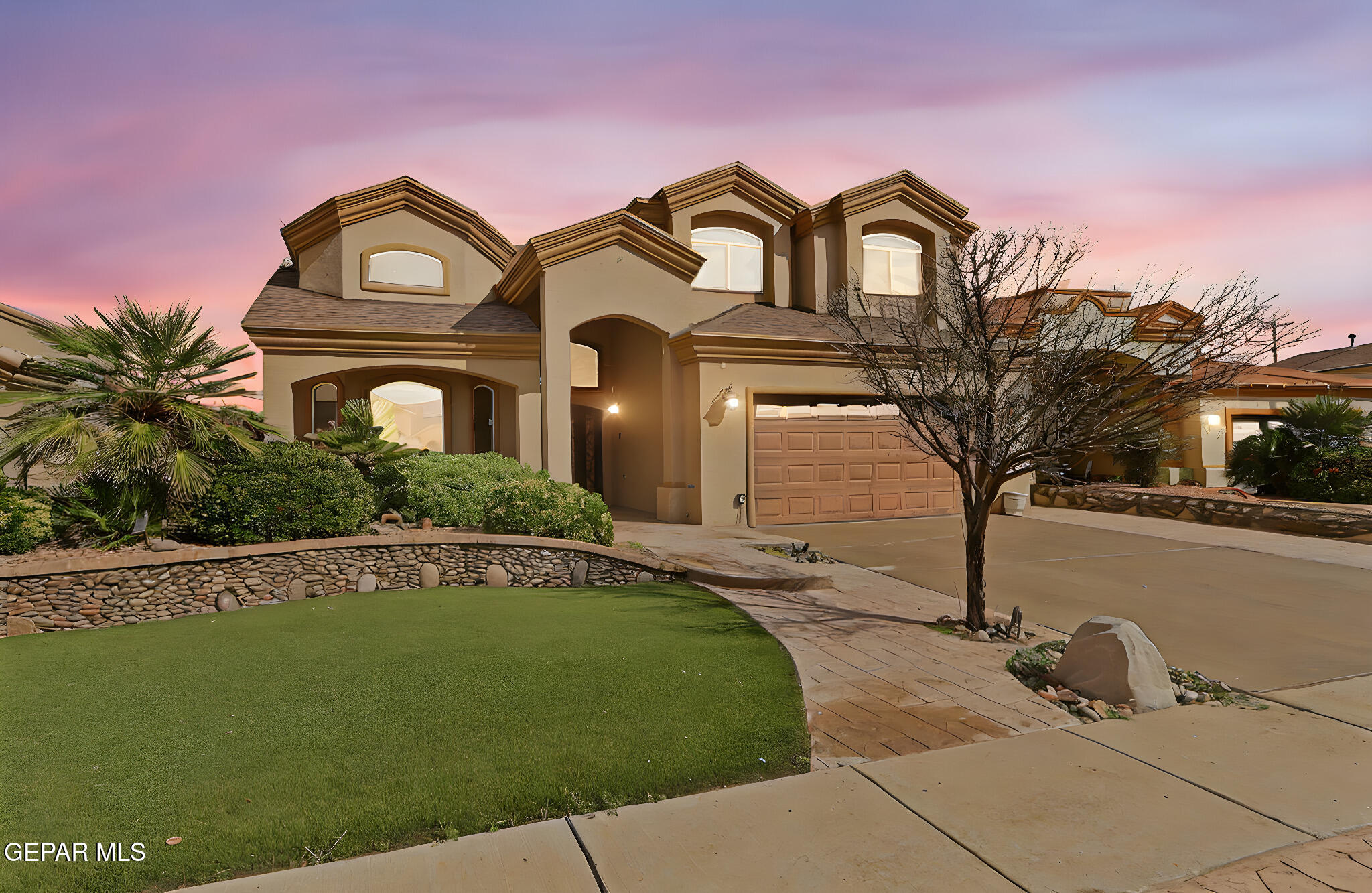 3644 Tierra Inca Drive El Paso, TX 79938 - Photo 2 of 53 a front view of a house with a garden