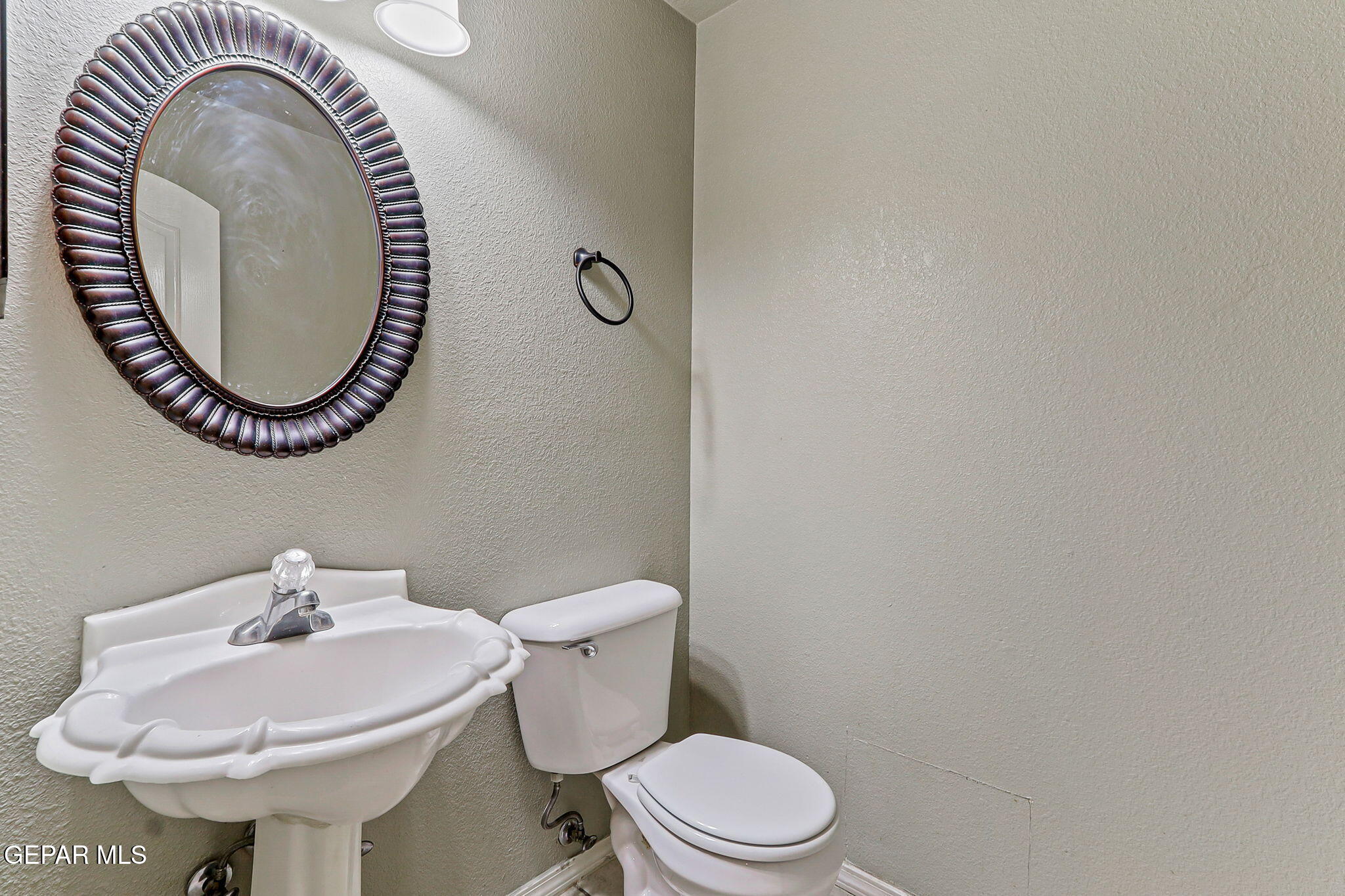 3644 Tierra Inca Drive El Paso, TX 79938 - Photo 22 of 53 a bathroom with a sink a toilet and a mirror