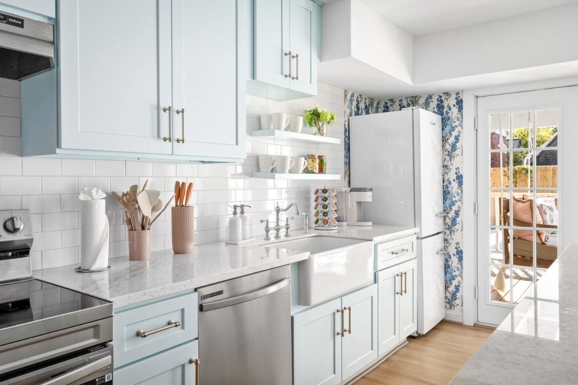 3236 Binz Street Houston, TX 77004 - Photo 11 of 50 a kitchen with refrigerator and cabinets