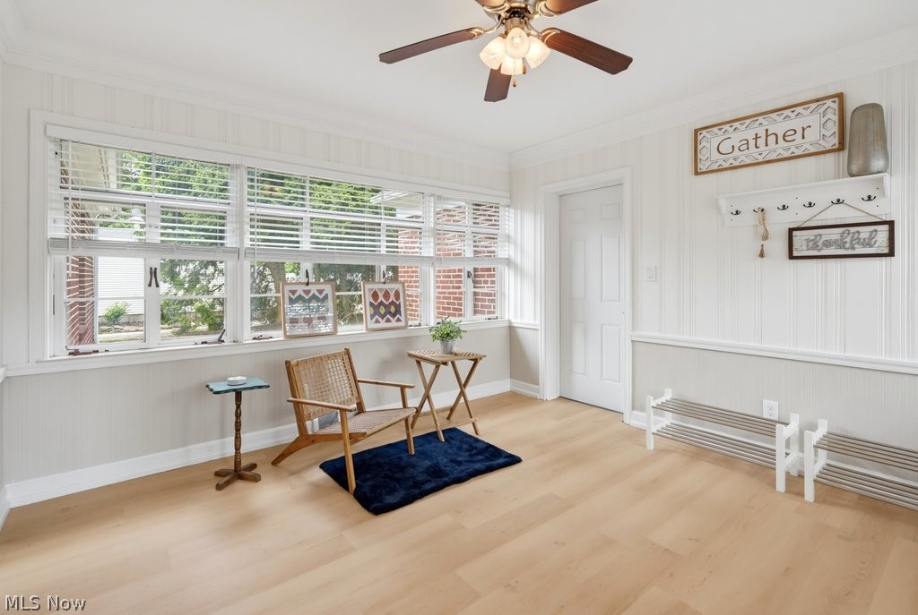 2468 Ridgewood Road Akron, OH 44313 - Photo 25 of 50 Wood-finish flooring, white paneled walls, and a ceiling fan with integrated lighting