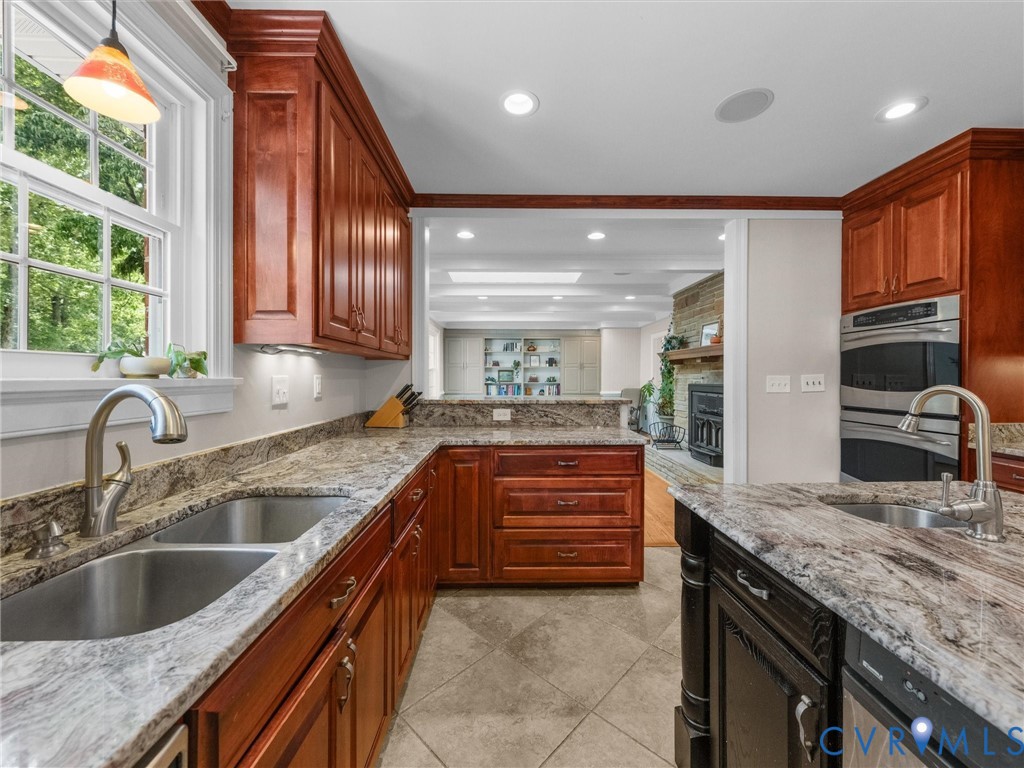 13099 Cedon Road Ashland, VA 23005 - Photo 19 of 92 Chef's kitchen featuring rich wood cabinetry, stai