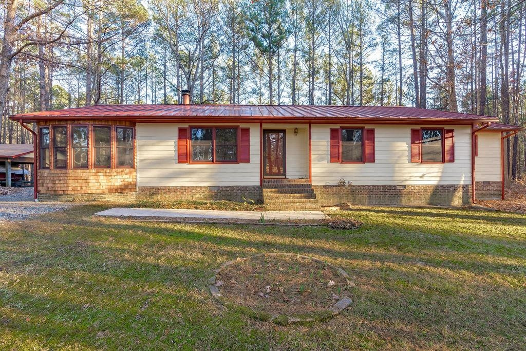 8933 Barker Road New Hill, NC 27562 - Photo 1 of 30 3 Bedroom Ranch with Unique Charm