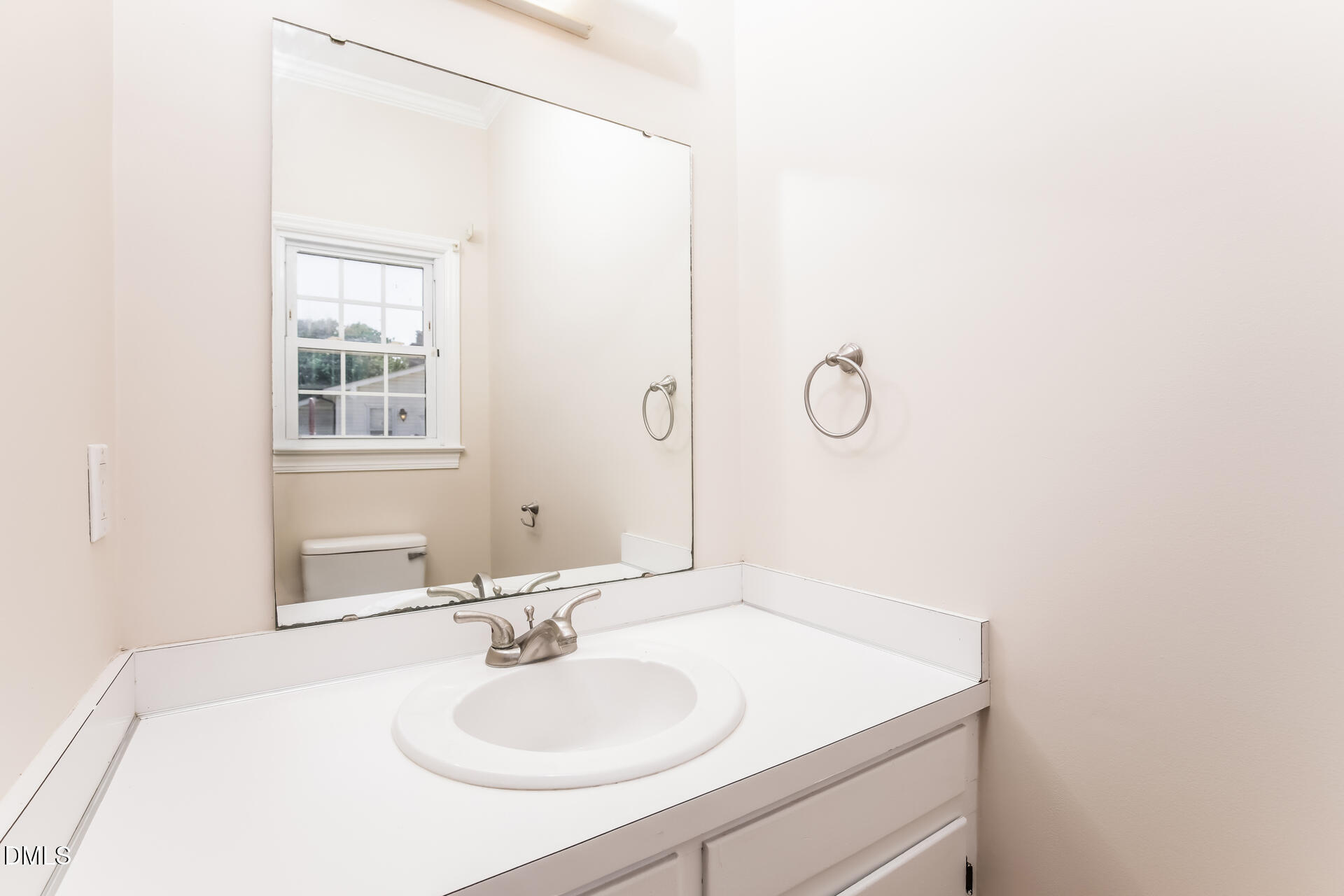 870 Abbott Road Henderson, NC 27537 - Photo 16 of 20 a bathroom with a sink and a mirror