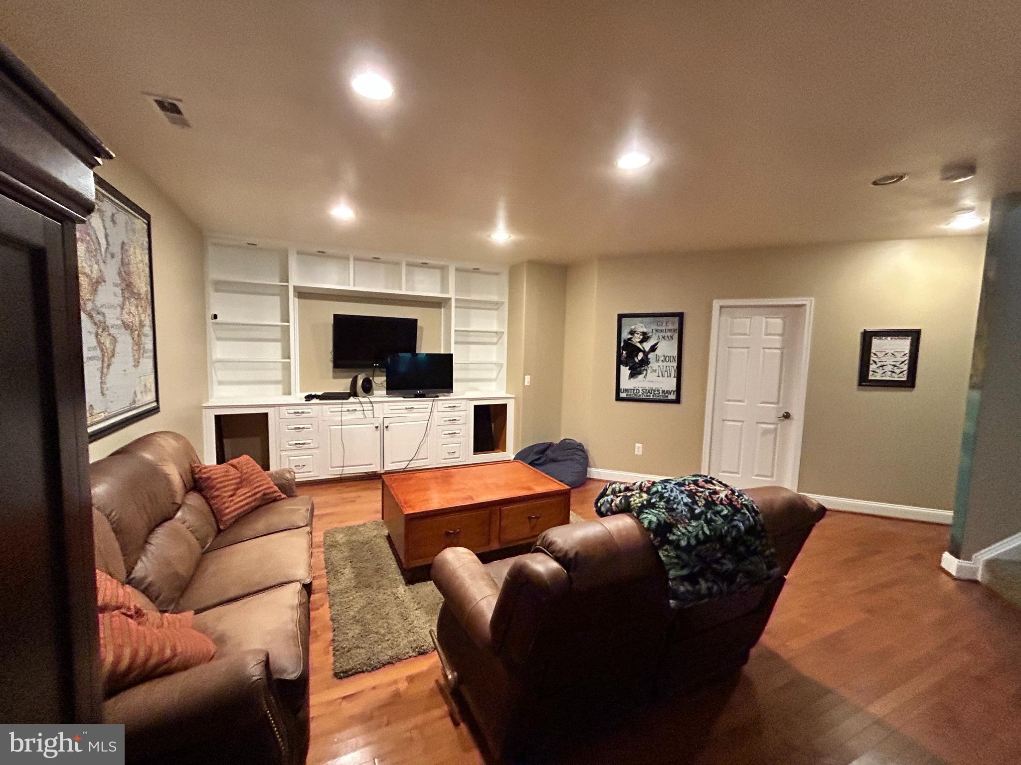 690 Good Shepherd Way Owings, MD 20736 - Photo 11 of 27 a living room with furniture and a flat screen tv