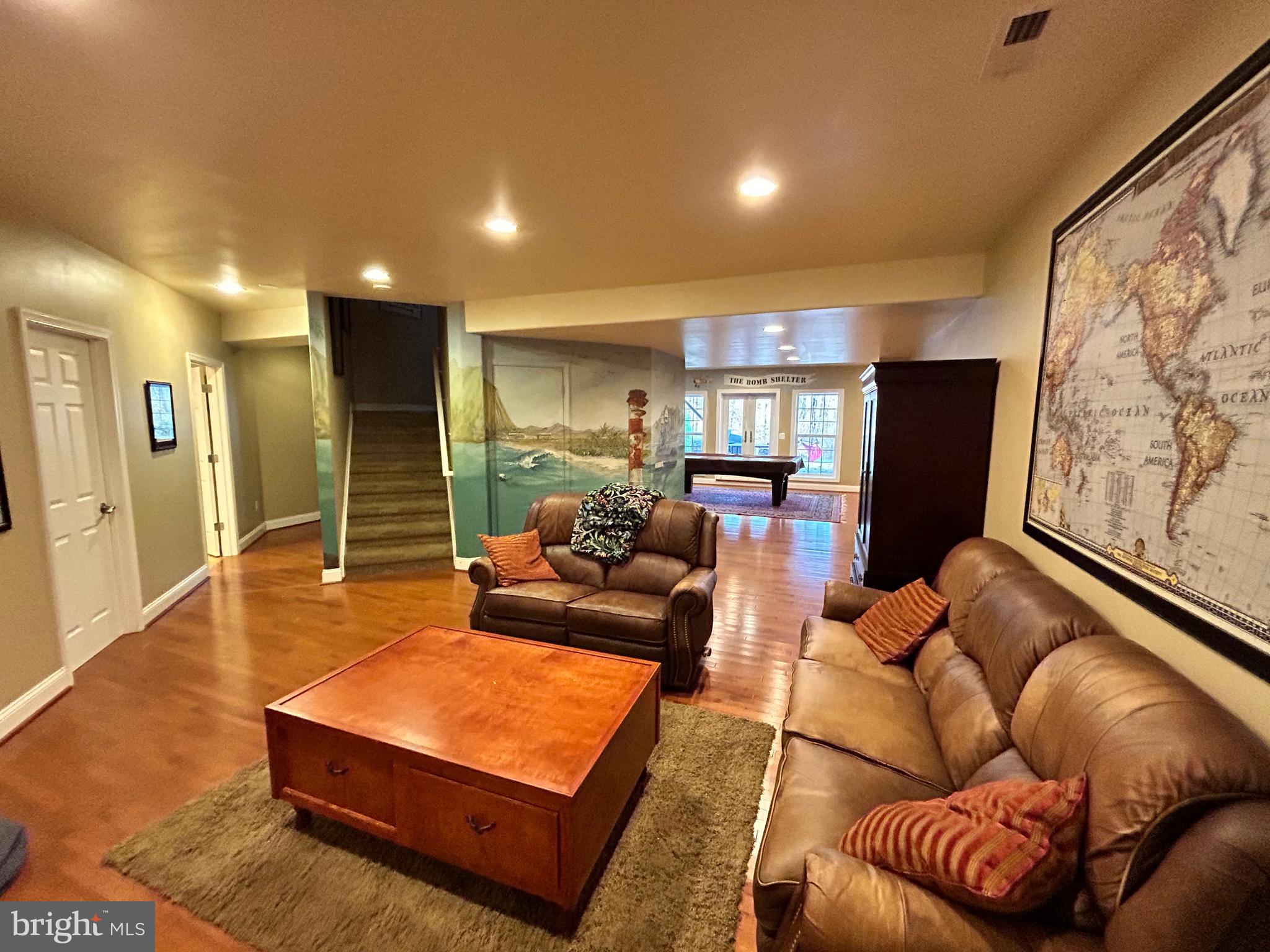 690 Good Shepherd Way Owings, MD 20736 - Photo 12 of 27 a living room with furniture and a flat screen tv