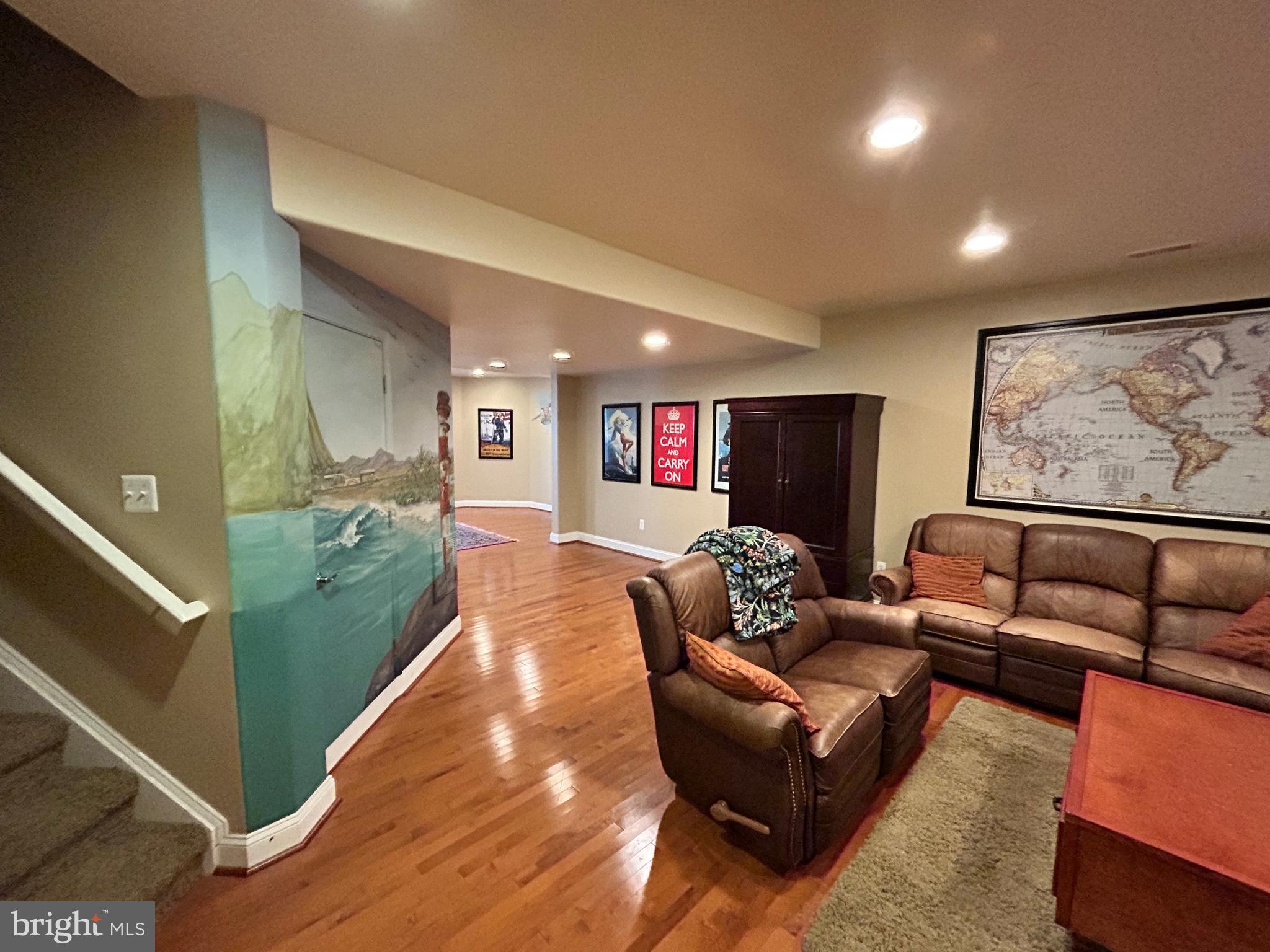 690 Good Shepherd Way Owings, MD 20736 - Photo 13 of 27 a living room with furniture and a flat screen tv