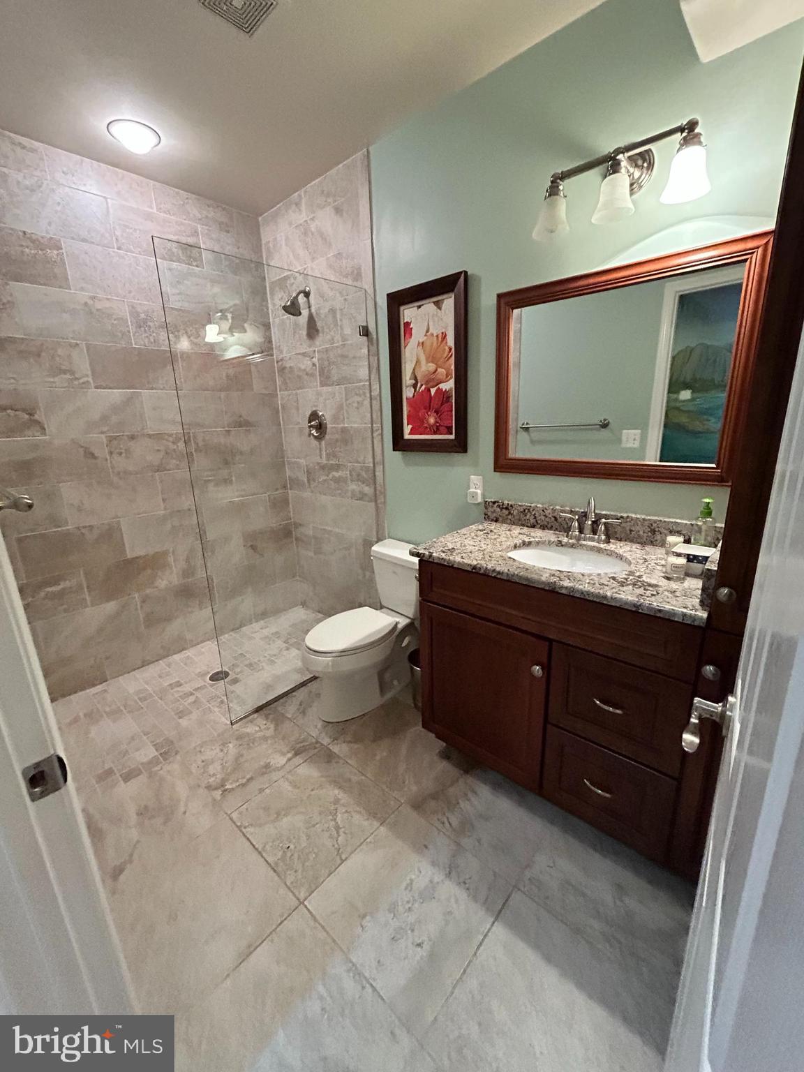 690 Good Shepherd Way Owings, MD 20736 - Photo 17 of 27 a bathroom with a sink a toilet and shower