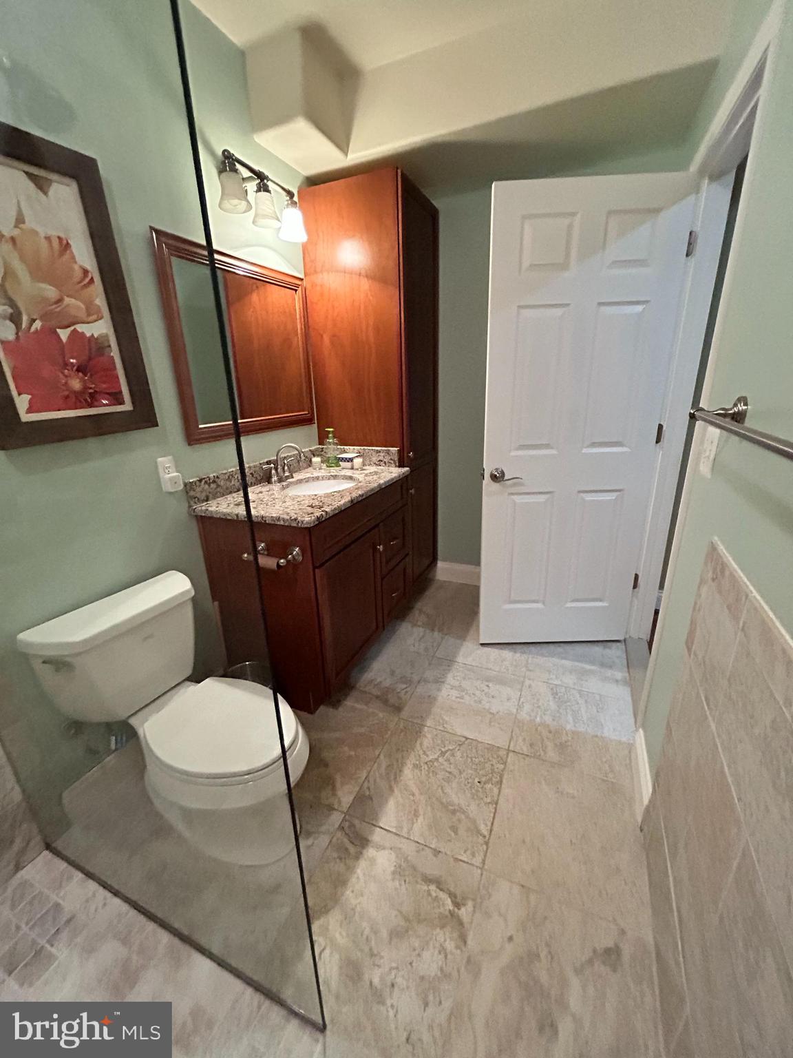 690 Good Shepherd Way Owings, MD 20736 - Photo 18 of 27 a bathroom with a toilet sink and mirror