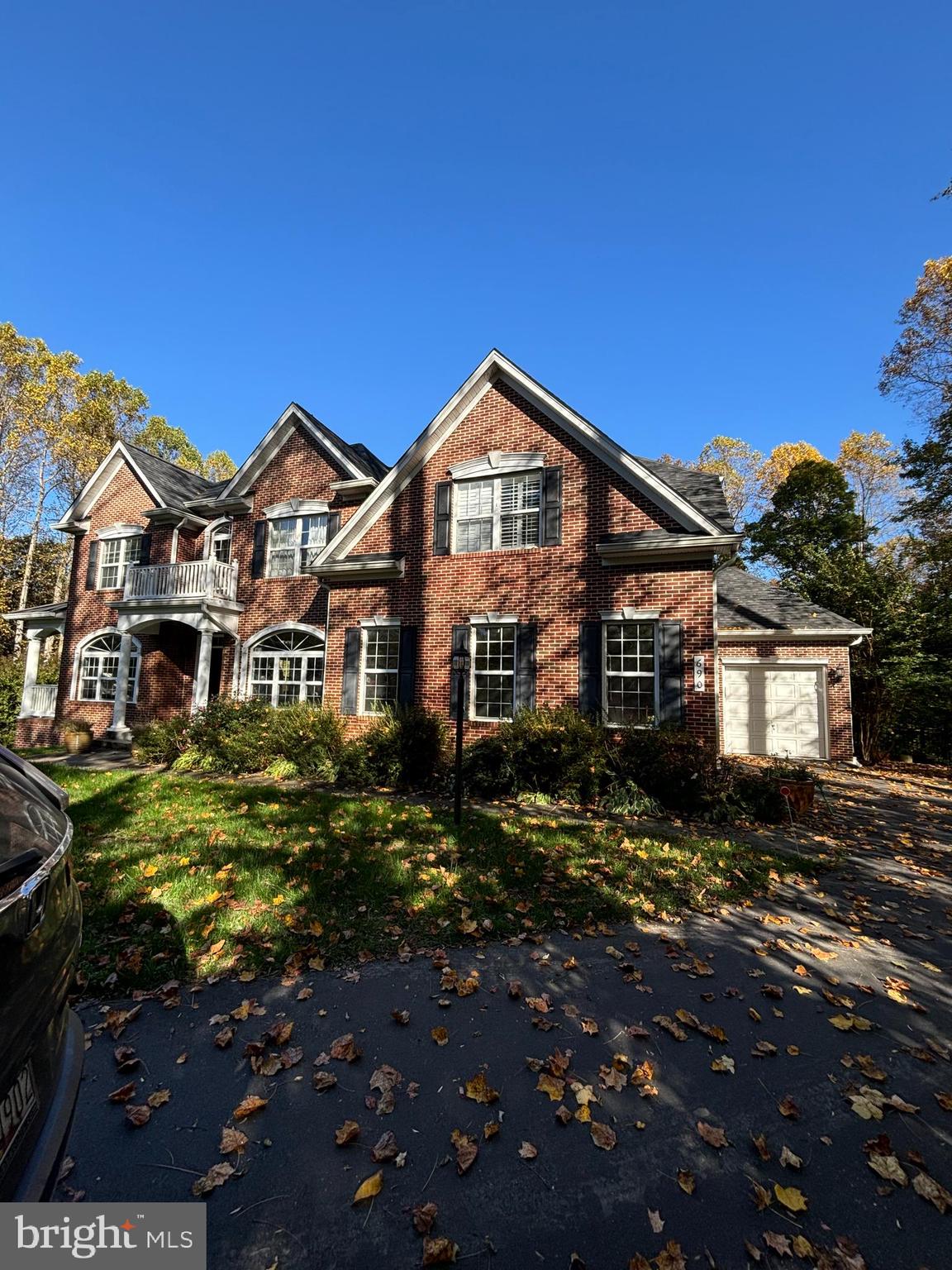 690 Good Shepherd Way Owings, MD 20736 - Photo 2 of 27 a front view of a house with a yard