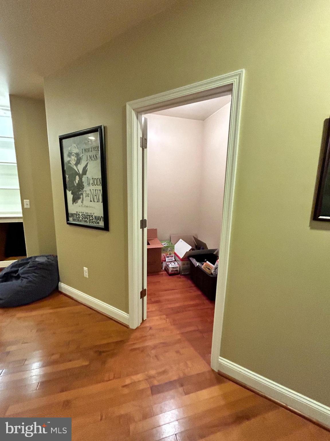 690 Good Shepherd Way Owings, MD 20736 - Photo 22 of 27 a view of a hallway with wooden floor and a workspace