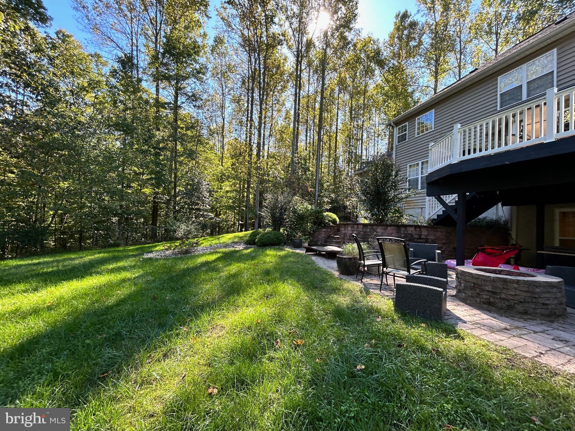 690 Good Shepherd Way Owings, MD 20736 - Photo 26 of 27 a view of a chairs and tables in the patio and a fountain in yard