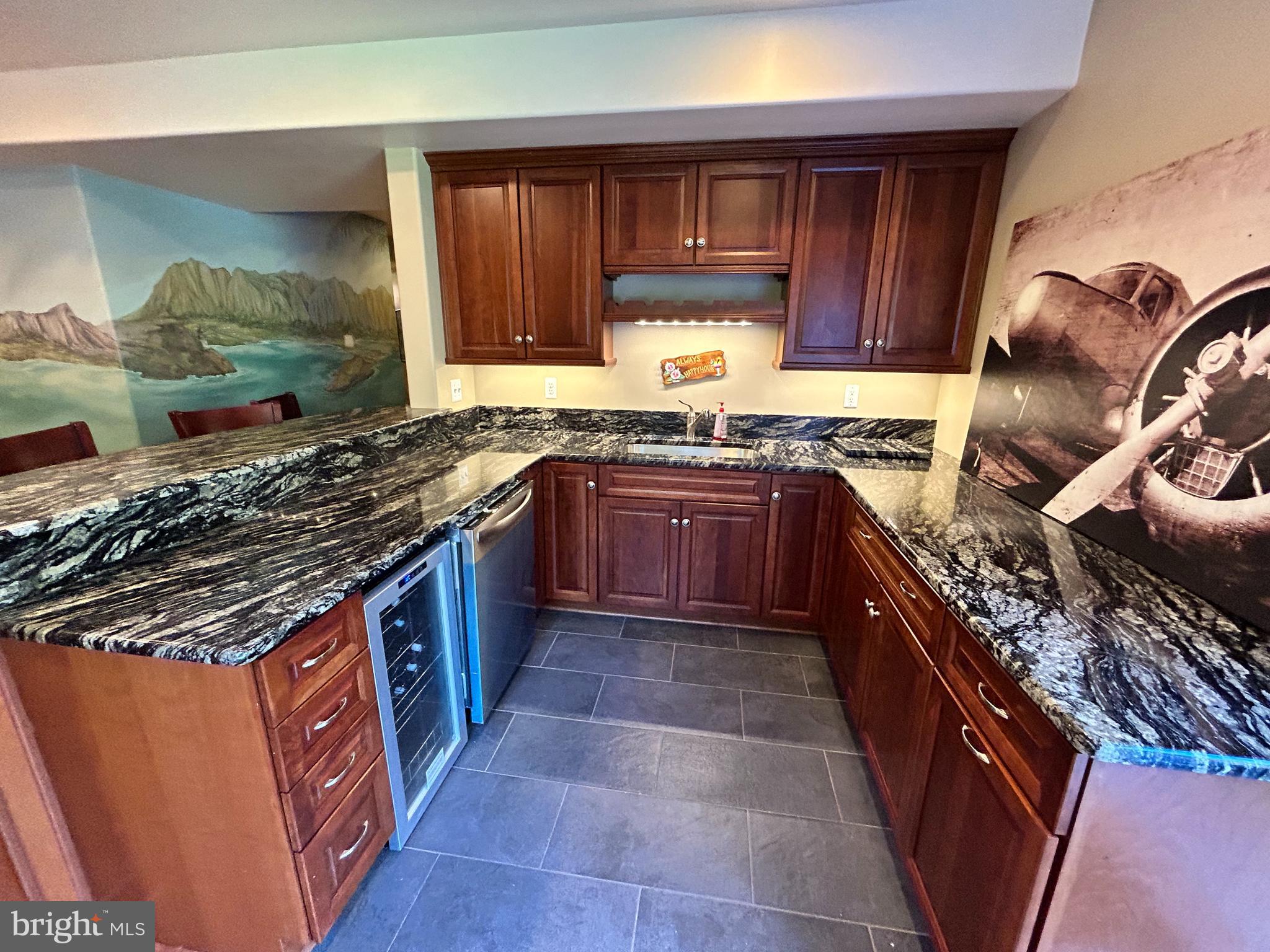 690 Good Shepherd Way Owings, MD 20736 - Photo 4 of 27 a kitchen with wooden cabinets and a stove top oven