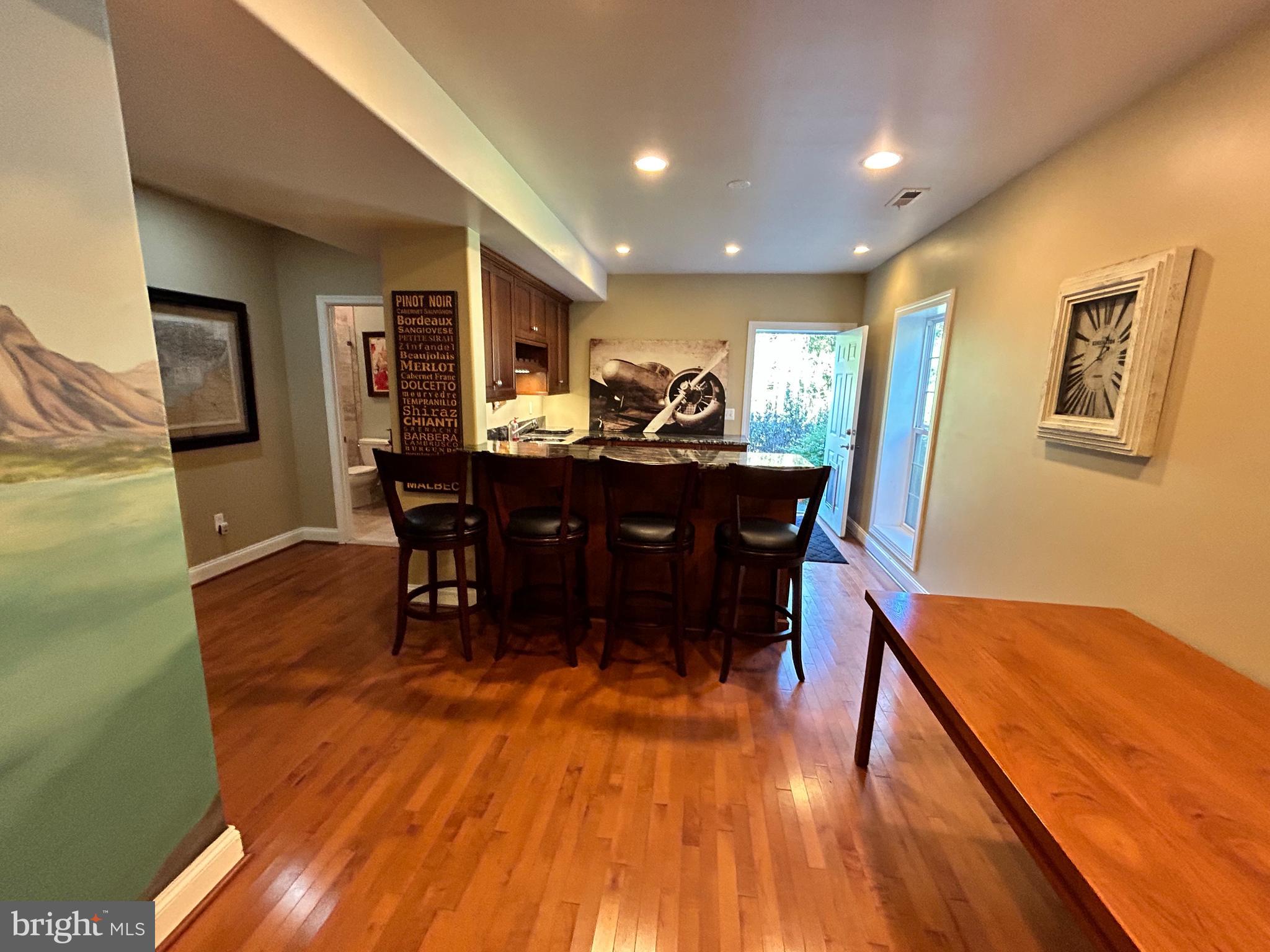 690 Good Shepherd Way Owings, MD 20736 - Photo 8 of 27 a view of a dining room with furniture window and wooden floor
