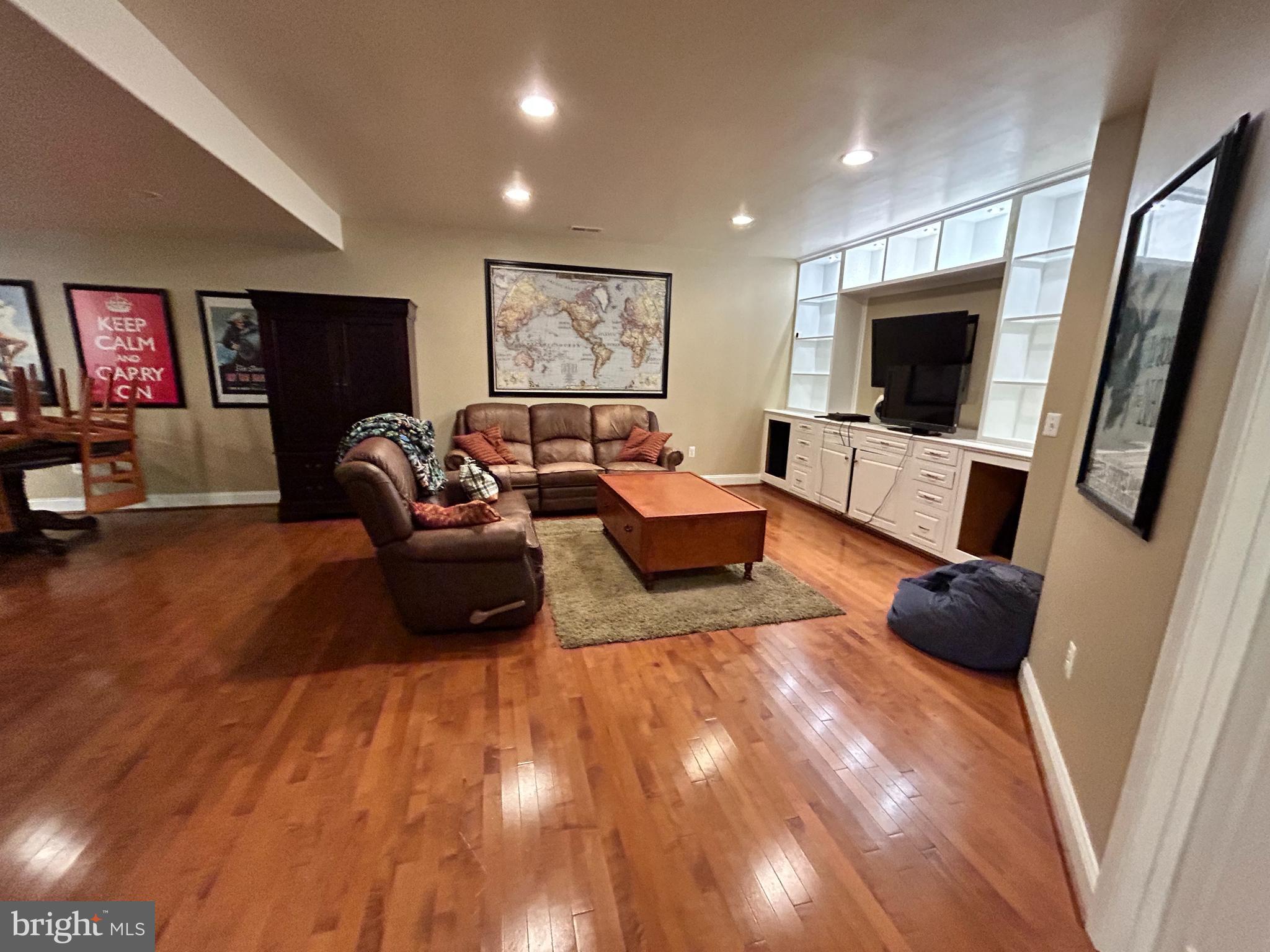 690 Good Shepherd Way Owings, MD 20736 - Photo 10 of 27 a living room with furniture and a flat screen tv