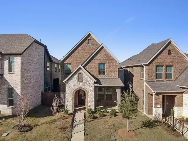 a front view of a house with yard
