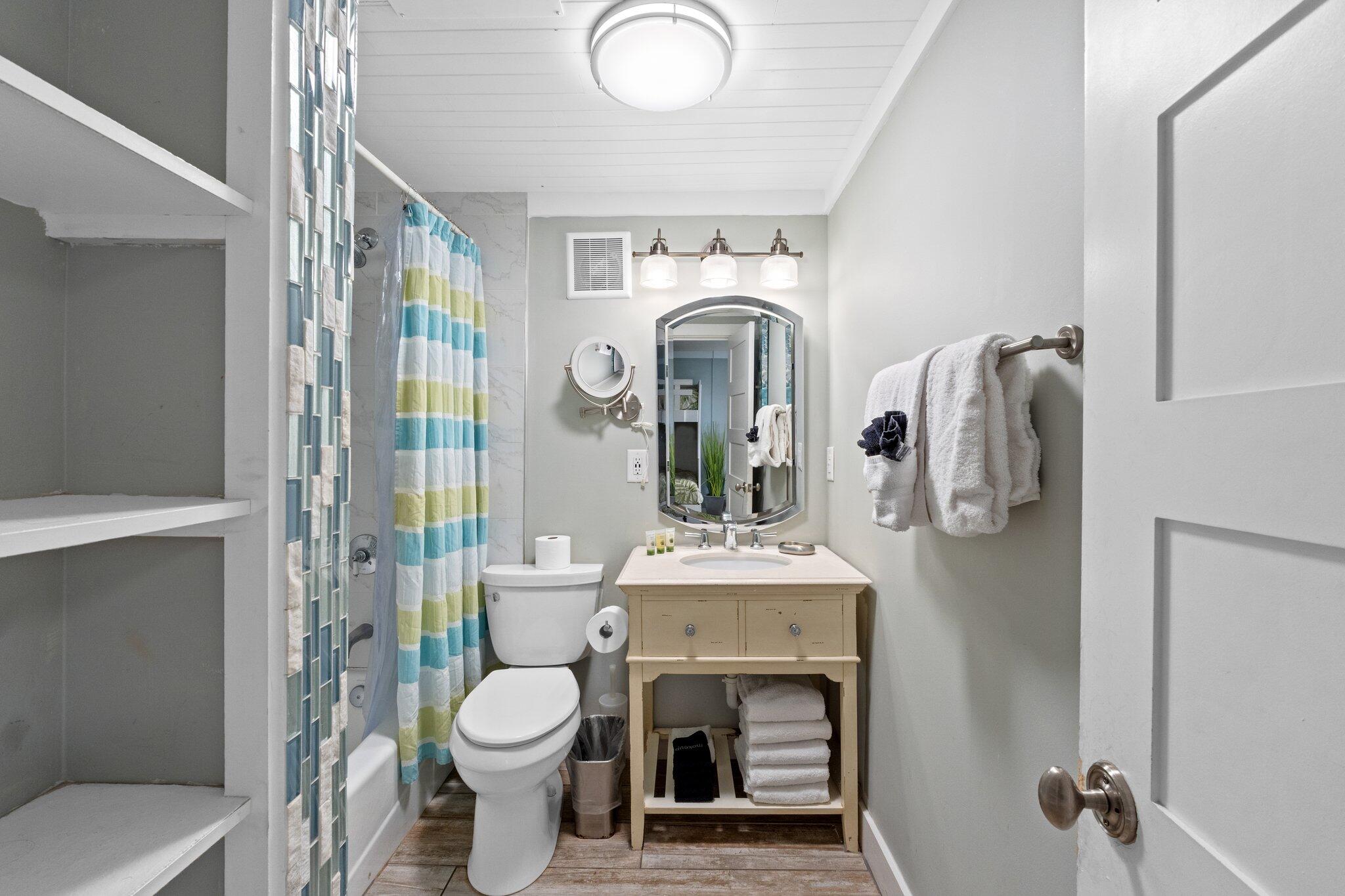 91 Cypress Hill Road Santa Rosa Beach, FL 32459 - Photo 18 of 66 a bathroom with a toilet sink and mirror