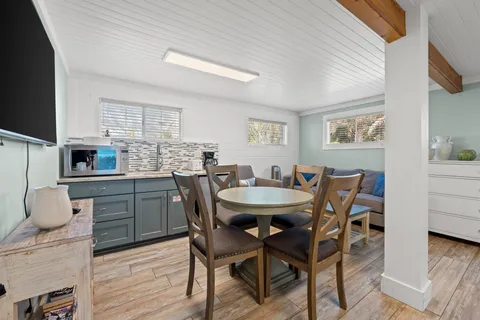 a view of a room with wooden floor and outdoor space