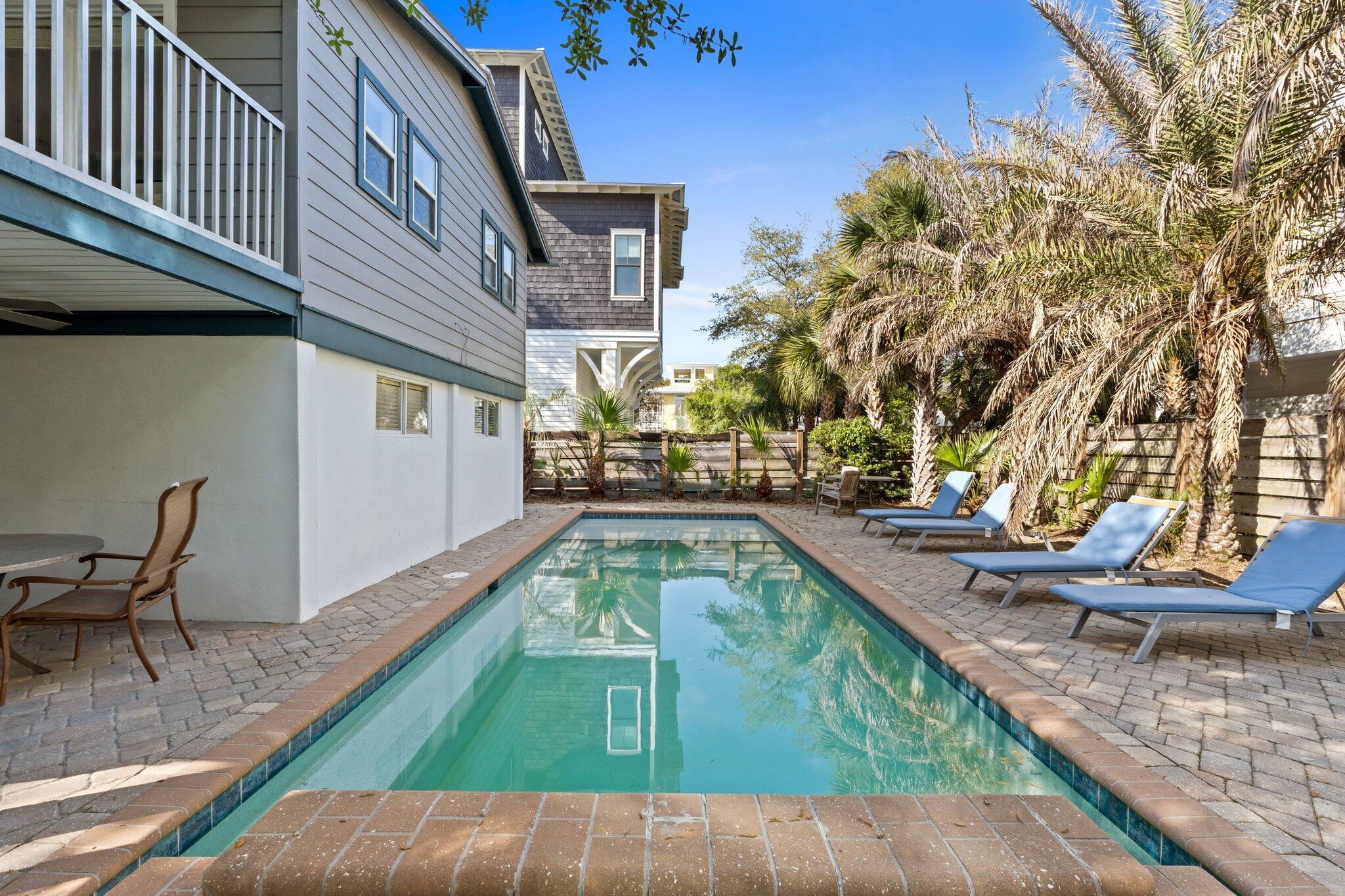 91 Cypress Hill Road Santa Rosa Beach, FL 32459 - Photo 3 of 66 a view of a swimming pool with chairs